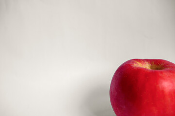 A Single Red Fuji Apple in a White Isolated Background