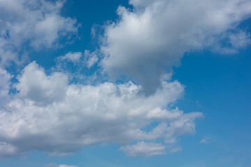 Fototapeta premium Blue sky with white cirrus and cumulus clouds during summer. Wheater, meterology and heaven.