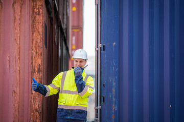 Foreman control forklift unloading truck at the container yard warehouse.