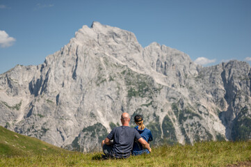 Couple enjoy the view of Slovenian mountains