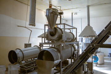 Extrusion machines of corn sticks and onion rings snack at factory conveyor for cereal snack...