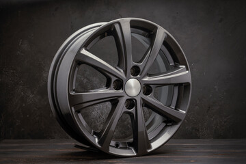 new grey allonew grey alloy wheels on a dark textured black background