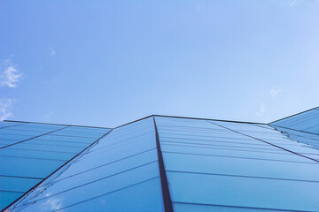 Glass building mixing with the sky