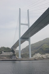 Obraz premium Megami big bridge toward battleship island. Gunkanjima ,near Mitsubishi shipyard in Nagasaki bay.