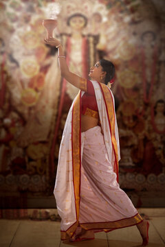 Bengali woman performing dhunuchi dance on the occasion of Durga Puja