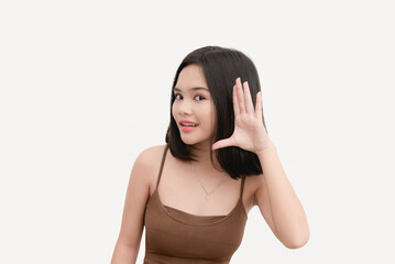 A cute woman wearing a brown tank top trying to hear isolated on a white background