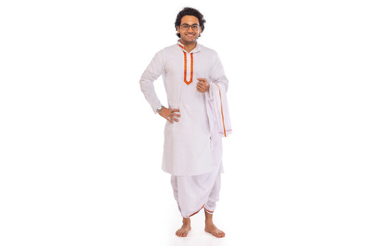 Portrait of Bengali man standing with hand on waist against white background