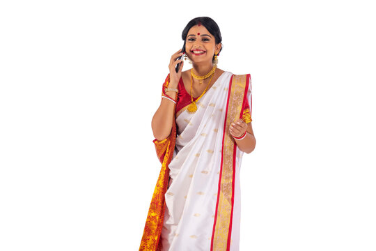 Young Bengali Woman Talking On Mobile Phone Against White Background