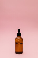 Serum in a glass jar with a pipette