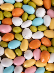 Assorted brightly colored candy gumballs or dragees