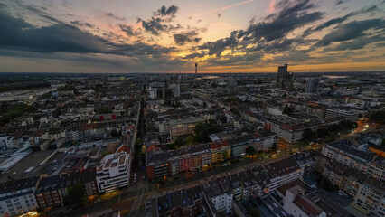 Düsseldorf city Germany nightscape with dramatic sky and rhine Rhein tower in the back at sunset