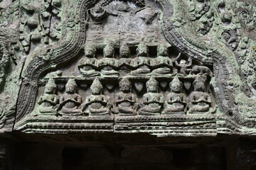 Carved Stone Figures in Prayer above Doorway at Ta Prohm, Siem Reap, Cambodia