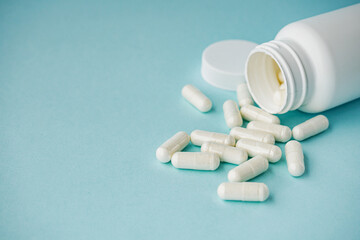 various medicines on a blue paper background