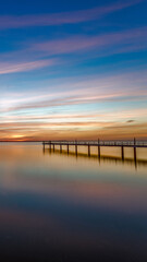 Fototapeta na wymiar sunset over the lake with bridge