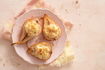 Delicious grilled pears baked with ricotta cheese and walnuts. honey topping. Healthy sweet dessert