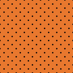 black polka dots on orange background seamless pattern
