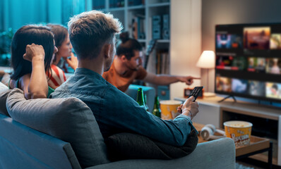 Friends watching movies together at home - obrazy, fototapety, plakaty