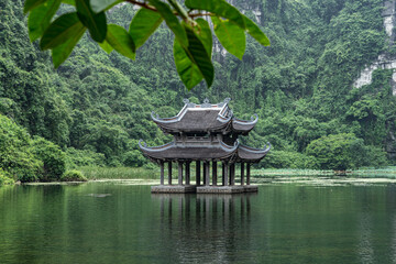 Vietnam pagoda. Trang An travel. Buddhist temple in nature. - obrazy, fototapety, plakaty