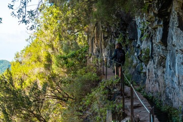 Trekking path next to the waterfall in the Levada do Caldeirao Verde, Queimadas, Madeira