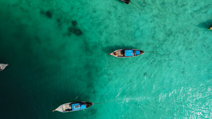 Photo in paradise island. Aerial photography of a boat in crystal clear waters. Phi Phi Island in Thailand. Paradise Beach. drone photography