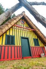 Fototapeta na wymiar Detail of a traditional Madeiran house like those of Santana in the forest of Caldeirao Verde, Santana