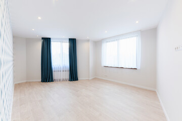 interior design of a room in a new building with large windows