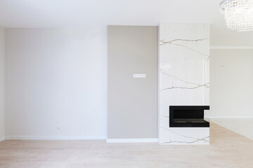 Fototapeta na wymiar interior design of a kitchen with a black bio fireplace