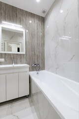 Fototapeta na wymiar stylish bathroom interior design with tiles and lighting