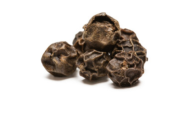 heap of black pepper, close-up macro photo. front view
