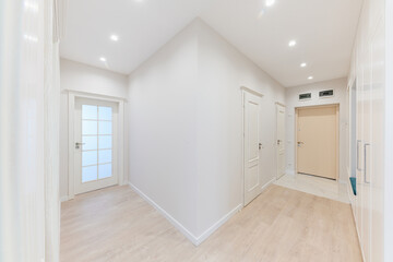 a large bright corridor in the new interior design of the house