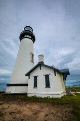 Low angle shot of Yaquina Head Lighthouse in Newport, Oregon on a cloudy day