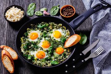 green shakshuka in frying pan, top view