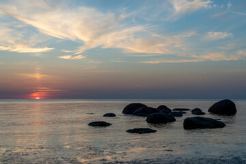 Fototapeta na wymiar Sunset over the calm Baltic Sea, Tuja, Latvia.