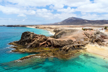Beautiful Papagayo Beach with white sand and black rocks on Lanzarote, Canary Islands, Spain