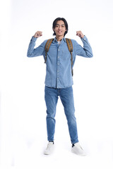 Full portrait casual  young man wearing jeans shirt, jeans with backpack with winner gesture isolated over white background.