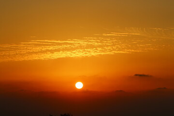 Fototapeta premium The sun sets below the horizon on the Mediterranean Sea in northern Israel.