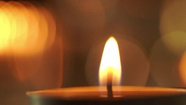 The light of the candles flame, the light of hope, memories, prayers and wishes, 4K.