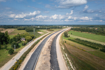 Fototapeta na wymiar Drone photo of building site of express road S7, view in Ruda village near Tarczyn, Poland