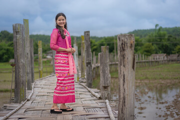 Beautiful Asian woman in traditional dress culture Thai costume of Tai people minority ethnic dress for holy days at Mae Hong Son, Northern Thailand.