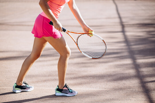 Young woman tennis player at the court