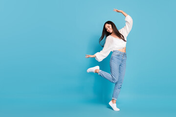 Full size photo of crazy carefree girl dancing partying spend pastime isolated on blue color...