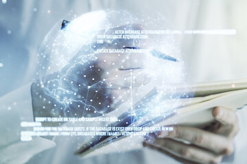 Multi exposure of abstract programming language hologram with world map and man hand writing in notepad on background, artificial intelligence and neural networks concept