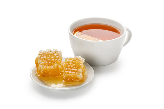 Tea with lemon and honey in Honeycomb on a white plate isolated on white background. Copy space.