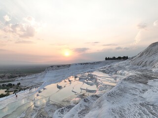 Pamukkale Travertines Cinematic Aerial Drone footage. Turkish famous white thermal bath with...