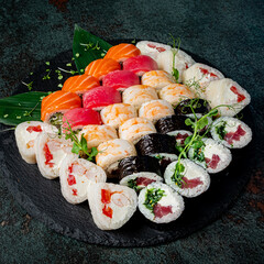 tasty sushi on the black stone