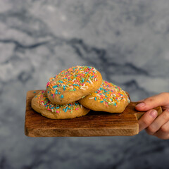 Cookies with sprinkle on top with banana flavor. 