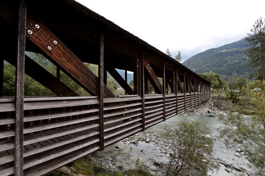 The wooden bridge across the Sarca River in Pinzolo, Trentino, Italy.