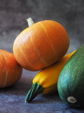 pumpkin and zucchini on a wooden table