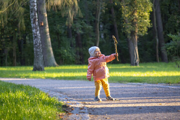 little child with a stick