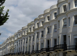 Street of Brighton with identical houses of curved facades.
England. United Kingdom.